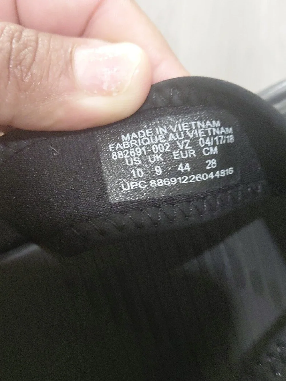 Nike Black Slip-On Sandals with White Swoosh Accent